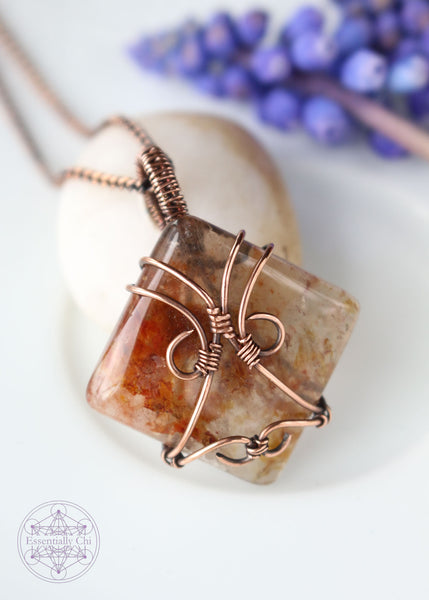 Indulge in the harmonious blend of strength and celestial beauty with our Hematite Garden Quartz Copper Wire Wrapped Necklace. The square-shaped garden quartz, resembling a wrapped package, showcases hematite inclusions, iridescent rainbows, and rutile. This handcrafted masterpiece promotes balance, protection, and a radiant connection to the divine. Perfect for Aries and Aquarius, this unique pendant aligns with the root and crown chakras, making it a symbol of grounding and spiritual elevation.