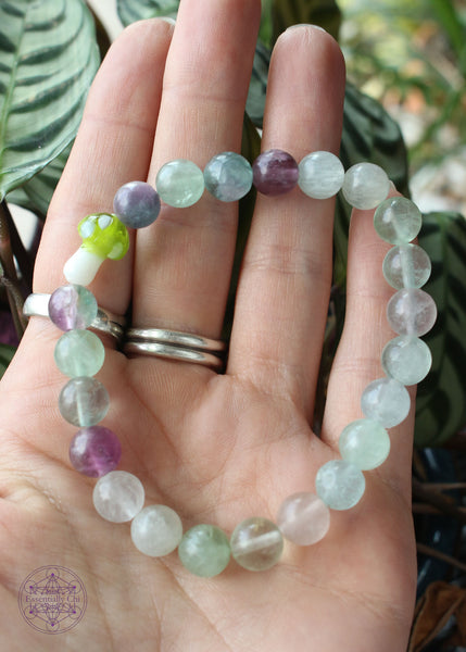 Green & purple fluorite stretch bracelet with a lime green glass mushroom focal bead.