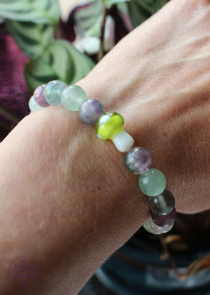Green & purple fluorite stretch bracelet with a lime green glass mushroom focal bead.