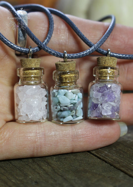 Crystal Chip Bottle necklaces in Amethyst, larimar, and rose quartz for a fun and simple style and fairy like charm. Hung on a black waxed cotton cord.