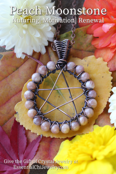 Peach Moonstone Pentacle Necklace - A mystical and bewitching pendant featuring a Peach Moonstone crystal with pentacle symbol and copper wire wrapping. Perfect for witches and Halloween enthusiasts. Enhance intuition, emotional healing, and embrace divine feminine energy with this magical jewelry. Peach moonstone beads line the outside of the circle of the pentacle design and are secured with copper wire crisscross pattern.