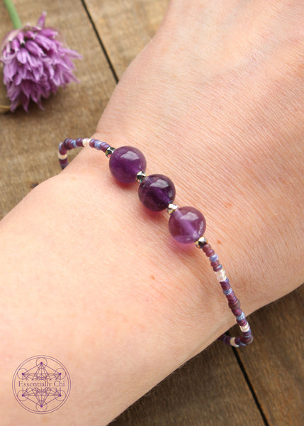 Beaded Stretchy Boho Stacker Bracelets. 8mm Purple Fluorite beads with purple, light blue, opalescent, and silver seed beads.