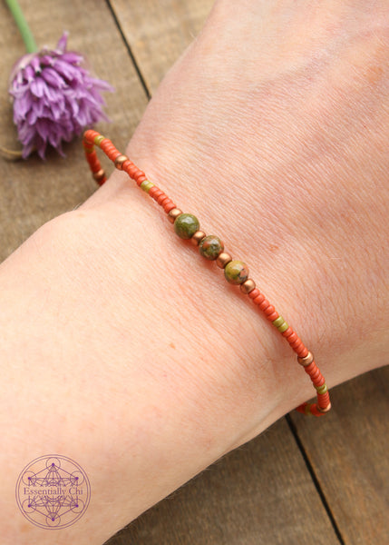 Beaded Stretchy Boho Stacker Bracelets. Unakite 4mm beads with terra cotta orange, Olive Green, and copper seed beads.