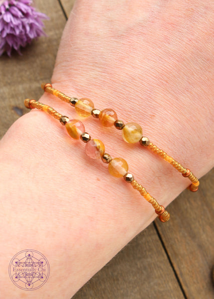 Beaded Stretchy Boho Stacker Bracelets. Faceted Golden Healer 6mm beads with transparent caramel, transparent orange, and brass seed beads.
