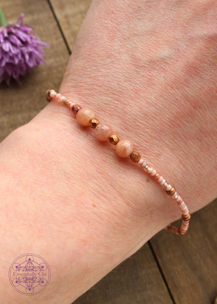 Beaded Stretchy Boho Stacker Bracelets. peach moonstone 4mm beads with peach & opalescent, and copper seed beads.