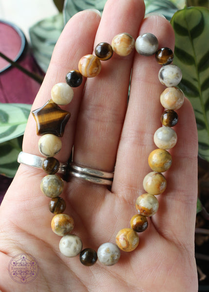 Solar plexus energy crystal stretch bracelet with a star shaped tiger eye focal bead, 8mm crazy lace agate beads, and 6mm tiger eye round beads.