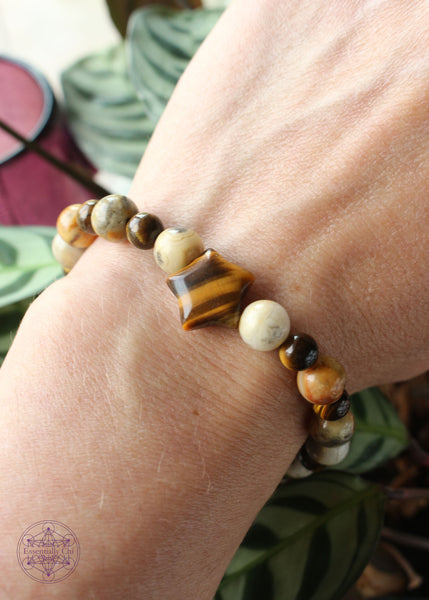 Solar plexus energy crystal stretch bracelet with a star shaped tiger eye focal bead, 8mm crazy lace agate beads, and 6mm tiger eye round beads.