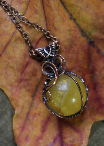Yellow Fluorite Crystal Ball Copper Wire Wrapped Necklace - A stunning solar plexus chakra crystal adorned with rainbows, empowering your inner strength.