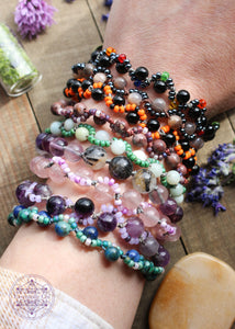 Hand-knotted beaded boho bracelets. Cord is nylon. Bracelets contain a gemstone bead with an S-curve of glass seed beads on one side or the other.