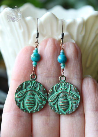 Chrysocolla Copper Bee Earrings, 2.25 inches in length with Chrysocolla beads and a green antiqued copper bee charm. Perfect for nature lovers and beekeepers, these earrings feature copper ear hooks for an earthy, elegant touch.