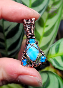 Copper Wire Wrapped larimar necklace in a triangle shape with small blue apatite beads in each corner. 