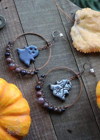 Ghostly Beaded Hoop Earrings featuring polymer clay ghost charms with a spooky-cute spider web design. Adorned with Botswana Agate, Rhodonite, and Blue Goldstone beads. Hoops measure 1.75 inches in diameter, with a total length of 3 inches. Perfect for a bewitching and whimsical look