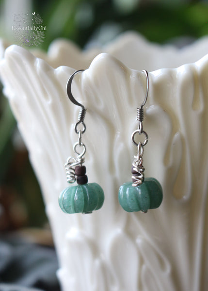 Charmingly dainty Green Aventurine Pumpkin Earrings, perfect for autumn. Hanging at 1.5 inches on sterling silver ear hooks, these earrings bring a touch of prosperity and heart chakra alignment. Ideal for pumpkin spice lovers and those seeking whimsical fall accessories