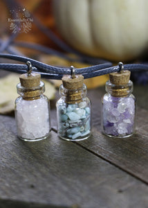 Crystal Chip Bottle necklaces in Amethyst, larimar, and rose quartz for a fun and simple style and fairy like charm. Hung on a black waxed cotton cord.