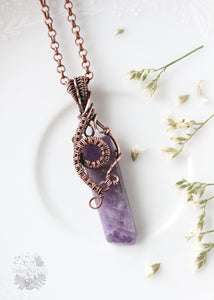 Immerse yourself in the magic of our Hecate Filigree Chevron Amethyst Copper Wire Wrapped Pendant. With an elaborate spiral weave design, this piece enhances intuition, offers psychic protection, and promotes emotional balance—a perfect companion for empaths seeking harmony.