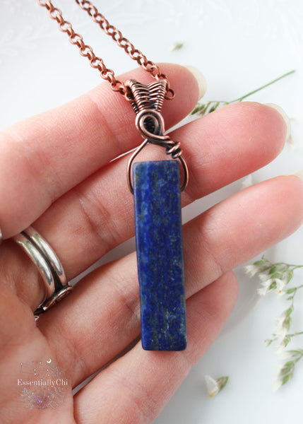 Elevate your energy with our Hera Lapis Lazuli Copper Wire Wrapped Pendant, designed for intuitive healing and self-expression. This exquisite piece resonates with the goddess's energy, promoting balance and wisdom in your spiritual journey.