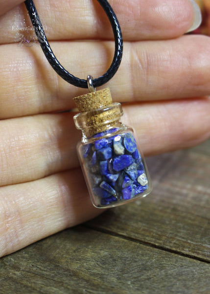 Lapis Lazuli Crystal Chip Bottle Necklace - A miniature bottle pendant filled with Lapis Lazuli chips, promoting wisdom and clear communication.