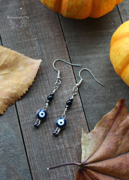 2-inch Black Onyx Evil Eye Dangle Beaded Earrings with a navy blue and silver-colored charm, hematite-colored beads, and customizable earring hooks in sterling silver, stainless steel, or niobium
