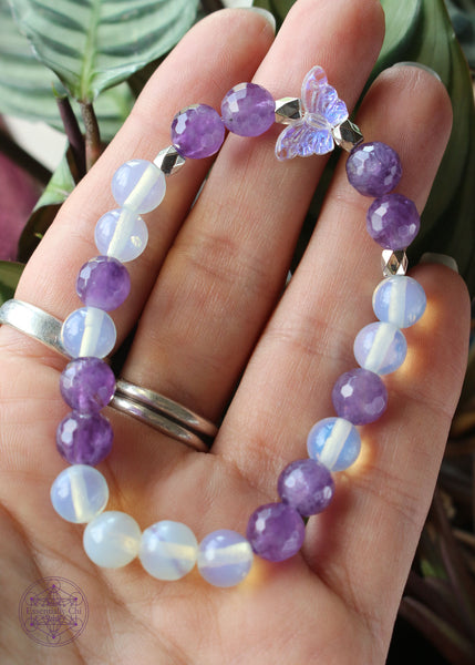 faceted amethyst and opalite stretch bracelet with an acrylic iridescent focal bead. 