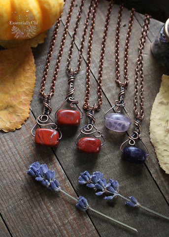 Introducing our Potion Bottle Copper Wire Wrapped Necklaces - a whimsical and versatile accessory featuring two enchanting gemstones: Purple Fluorite and Red Jasper. These charming necklaces are not only stylish but also carry the unique metaphysical properties of their respective crystals, making them perfect for everyday wear.