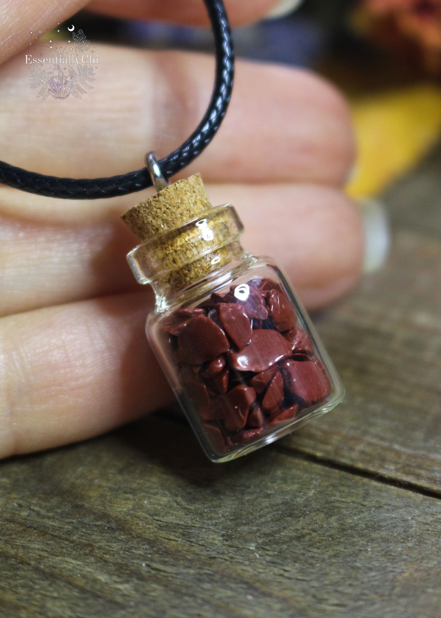 Red Jasper Crystal Chip Bottle Necklace - A tiny bottle pendant filled with Red Jasper chips, enhancing strength and grounding energy.