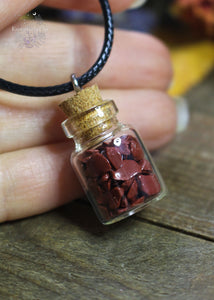 Red Jasper Crystal Chip Bottle Necklace - A tiny bottle pendant filled with Red Jasper chips, enhancing strength and grounding energy.