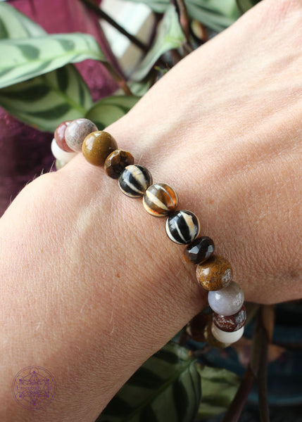 Crystal stretch bracelet tibetan agate, tiger eye, and ocean jasper 8mm beads.