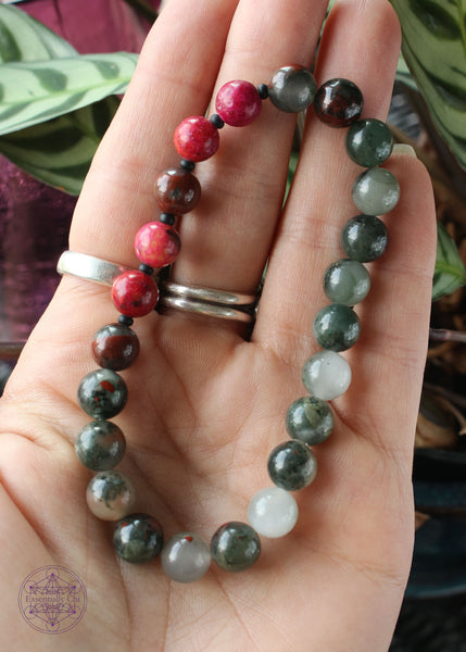 crystal stretch bracelet with hot pink chili jasper (dyed) beads and african bloodstone 8mm beads.