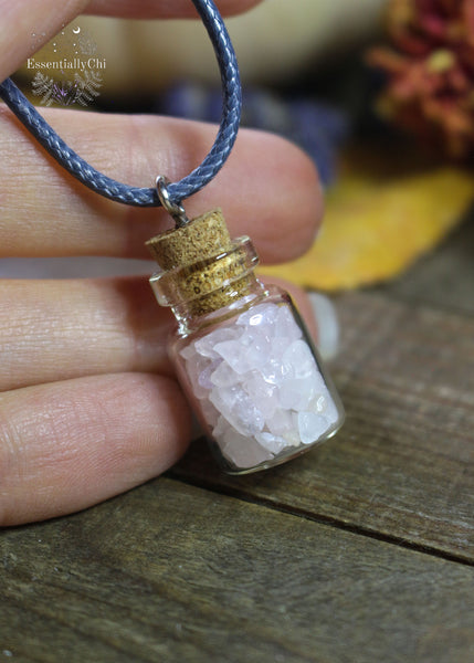 Rose Quartz Crystal Chip Bottle Necklace - A miniature bottle pendant filled with Rose Quartz chips, fostering love and emotional healing