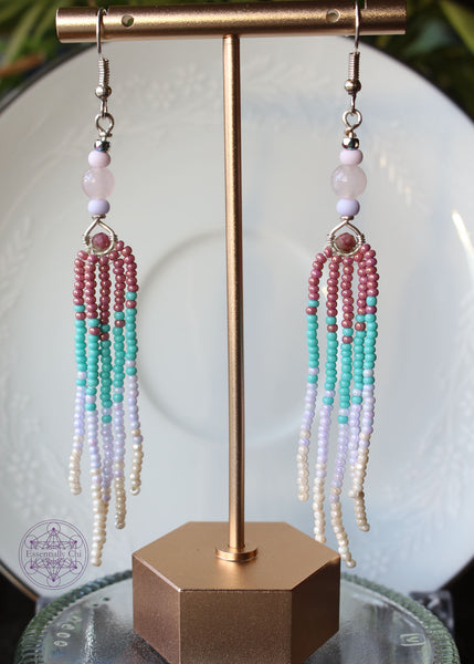 Rose Quartz and Pink Tourmaline Fringe Earrings, 3.5" long with genuine rose quartz and pink tourmaline beads, featuring a graduated mauve to aqua to white to pearl colored seed bead fringe design. show hanging. 