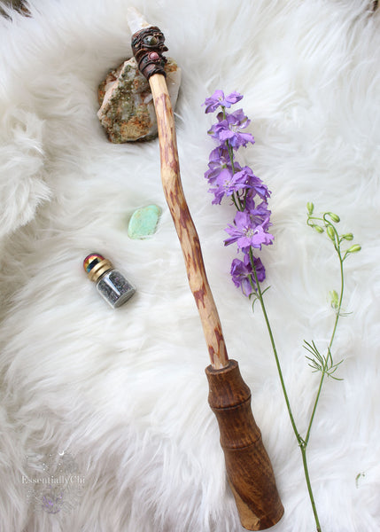 Unleash your inner enchantress with our handmade Enchanted Fairy Forest Wand – a symphony of cherry plum wood, polymer clay mushrooms, moss and vine, with vibrant crystals of spirit quartz, faceted labradorite, and rhodonite. Crafted with love, the custom wooden handle adds a personal touch. Perfect for cosplay, energy work, or sparking magic in your decor. Embrace the mystical allure of fairy vibes and woodland wonder. #FairyForestMagic #HandmadeWand #CrystalAlchemy