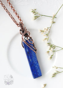 Harmonize your empathic soul with our Lapis Lazuli Copper Pendant. Enhancing intuition and emotional clarity, this exquisite piece is a conduit for transformative energy healing, aligning your essence for a balanced life