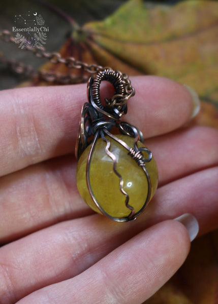 Yellow Fluorite Crystal Ball Copper Wire Wrapped Necklace - A stunning solar plexus chakra crystal adorned with rainbows, empowering your inner strength.