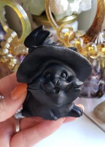 Obsidian helps with seeking the truth about yourself and acts quickly. A strongly protective stone, it forms a shield against negativity. It blocks psychic attacks and absorbs negative energies from the environment. Obsidian Meaning - Obsidian helps get to the root of stress & tension. It stimulates growth on all levels and helps bring clarity to the mind, clearing confusion. Place your Obsidian cat on your altar to scare the evil spirits away, or on your nightstand to keep nightmares at bay. 